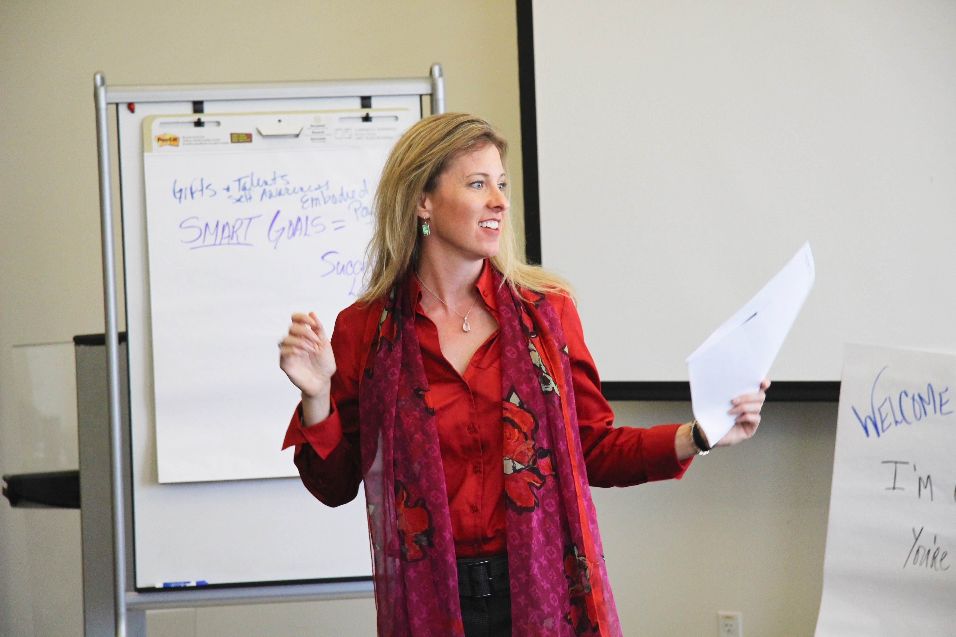 Amanda Carrothers facilitating a leadership workshop at the whiteboard